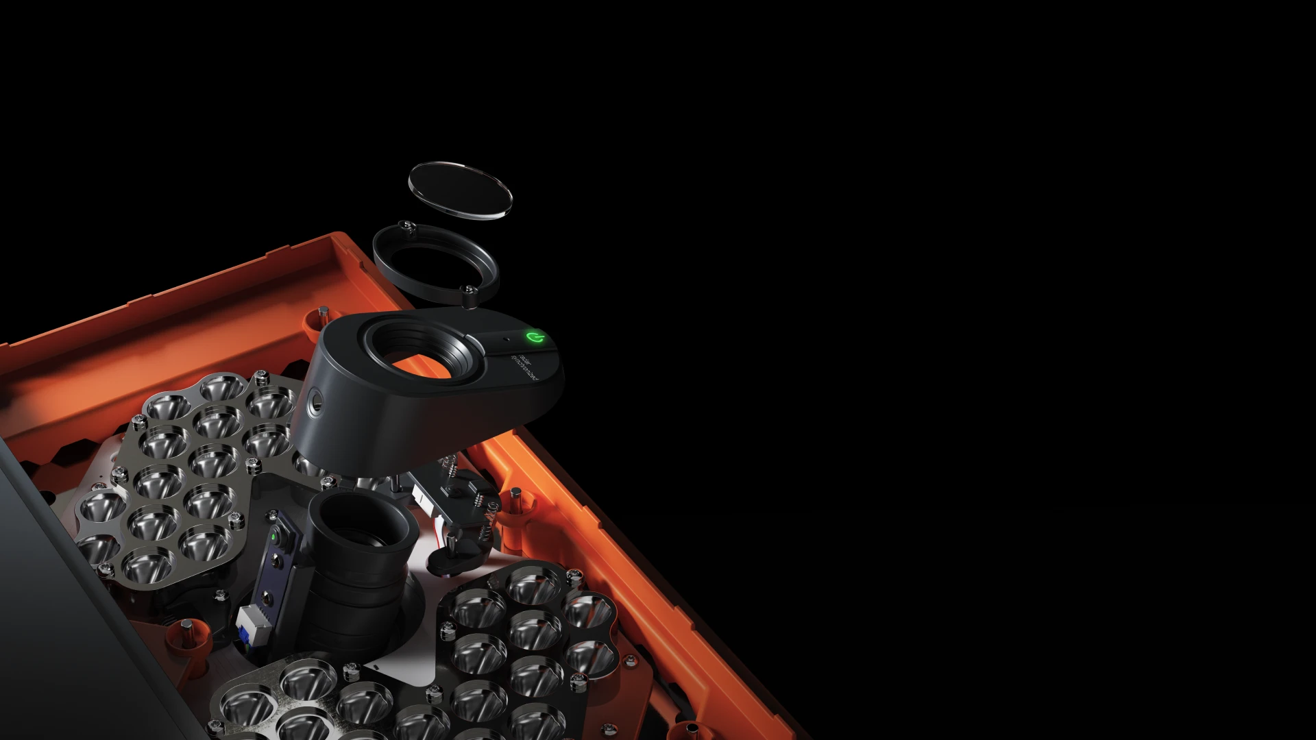 Close-up of a disassembled camera lens with multiple components, including a black lens barrel and orange casing, against a black background.