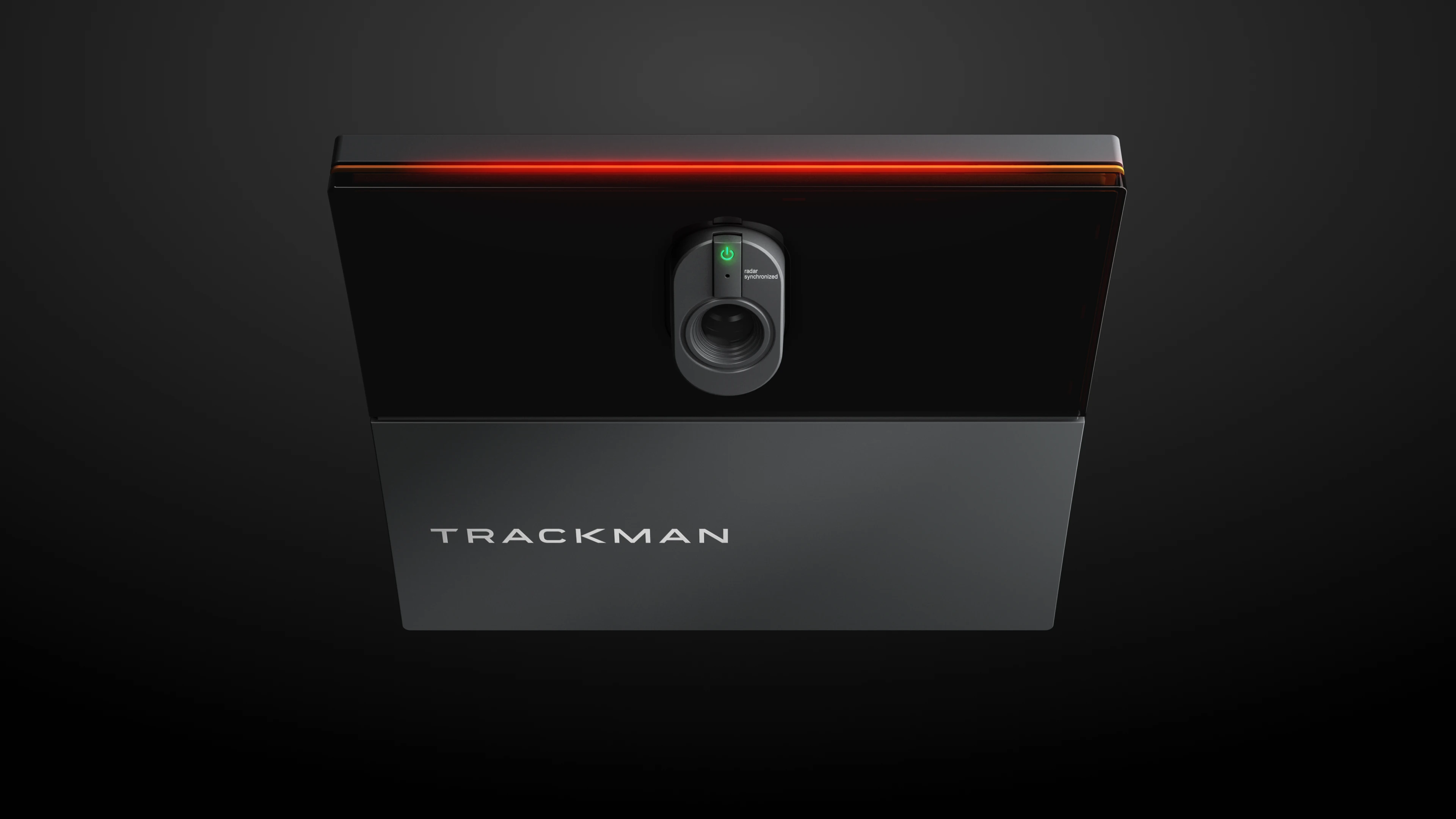A sleek TrackMan device with a radar sensor, illuminated by a red light strip on a dark background.