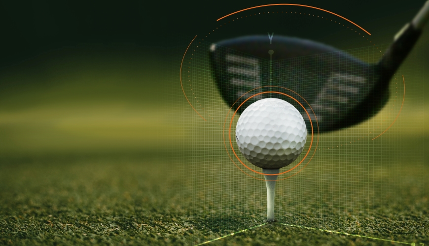 Close-up of a golf club about to hit a golf ball on a tee, with digital graphics overlay indicating focus and precision.