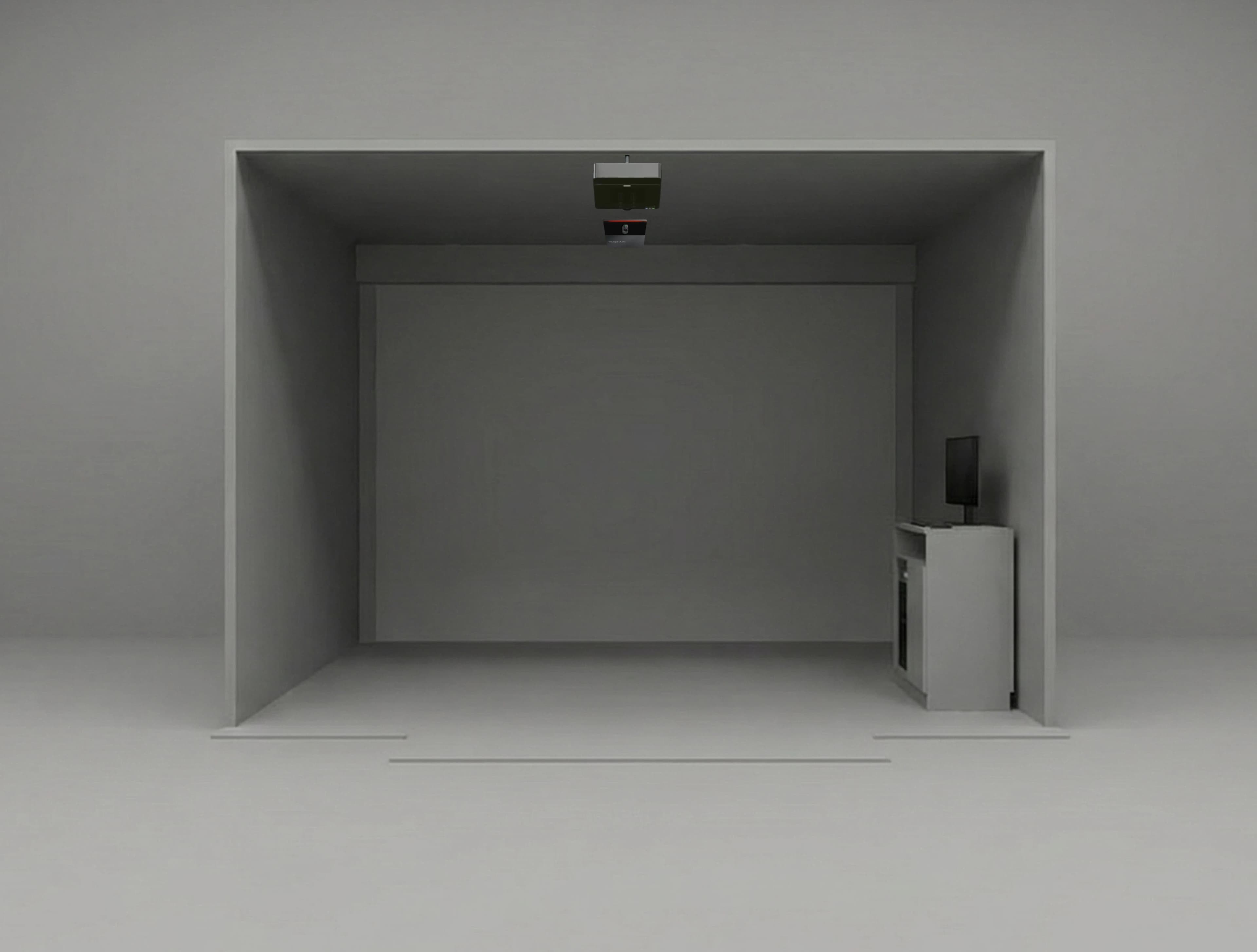 A minimalist gray room with a small monitor on a cabinet and a ceiling-mounted device facing inward.