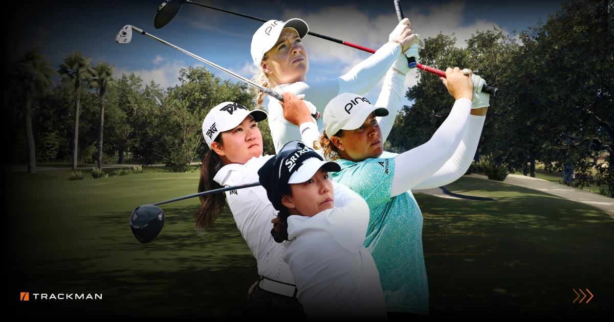 Four female golfers in action, swinging their clubs on a sunny golf course, with trees and a clear sky in the background.