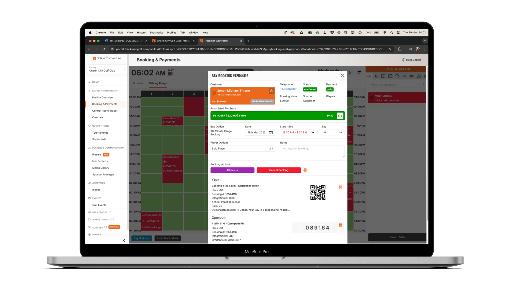 A MacBook Pro displays a Trackman booking and payments dashboard